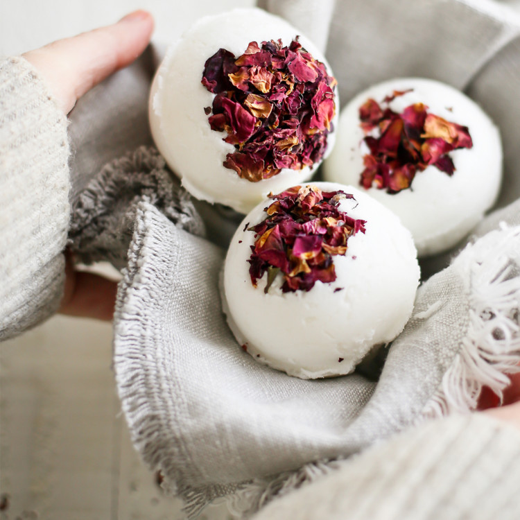 woman holding a basket of diy bath bombs