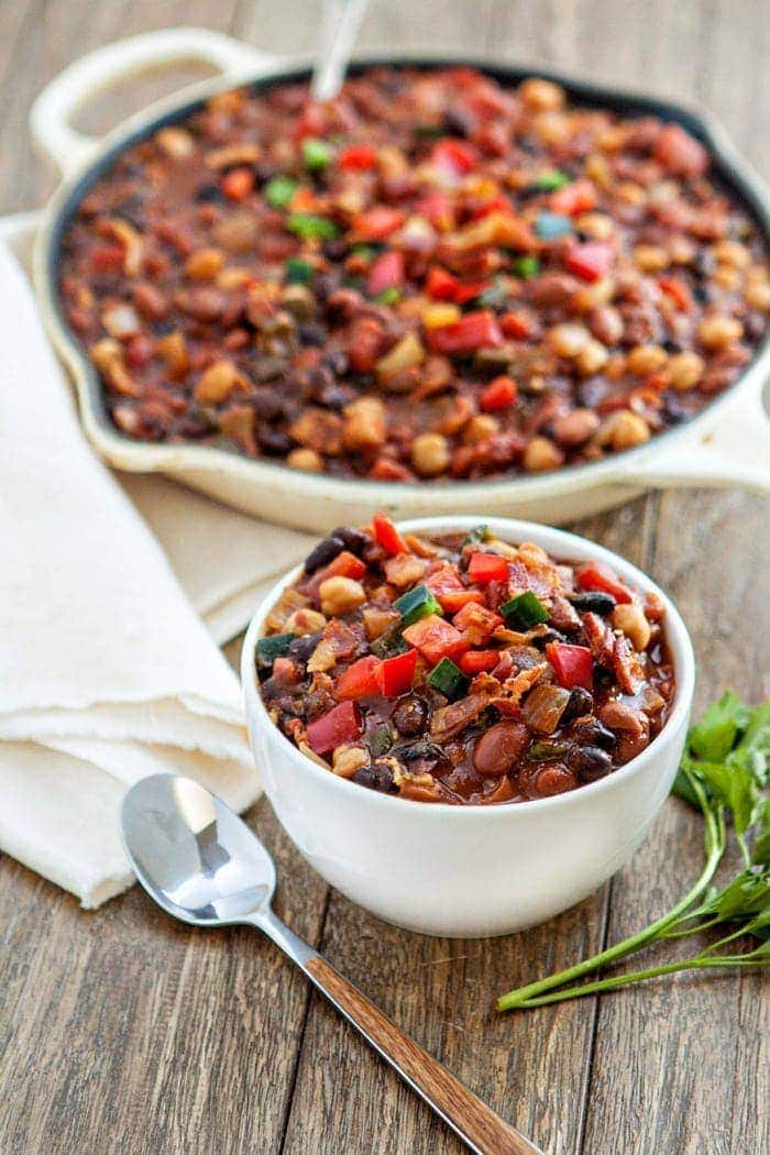 slow cooker baked bean trio with bacon and peppers