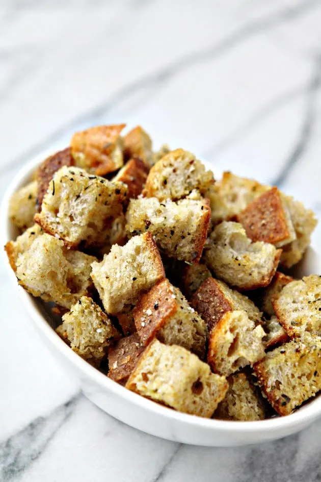 close up of Homemade Croutons in a large white bowl