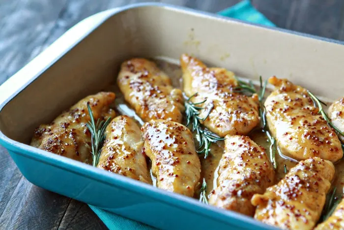baked honey mustard chicken in blue baking dish