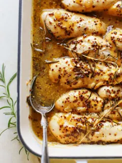 photo of honey mustard chicken in a white baking dish
