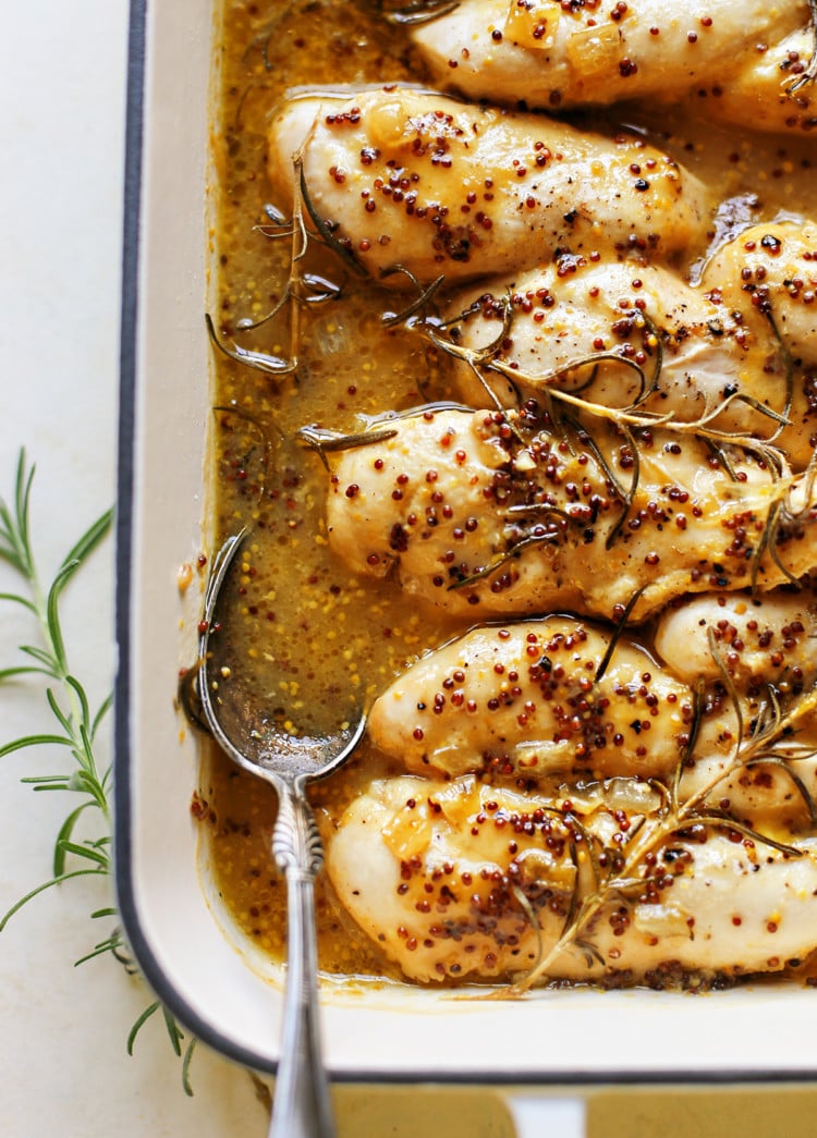 photo of honey mustard chicken in a white baking dish