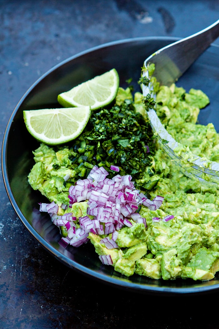 a photo of guacamole to serve with flank steak fajitas