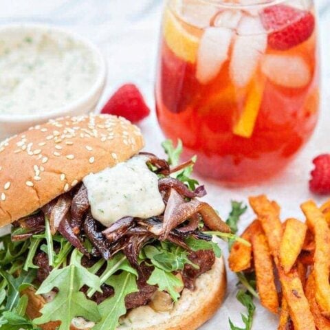 Gouda Stuffed Burgers with Horseradish Aioli and Caramelized Onions