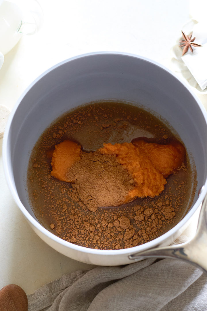 Pumpkin chai latte ingredients in a saucepan 