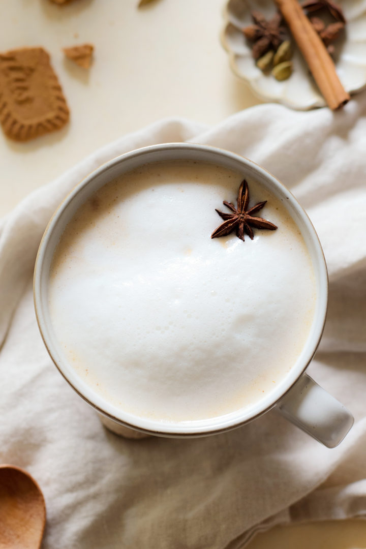 A pumpkin chai tea latte topped with milk foam 
