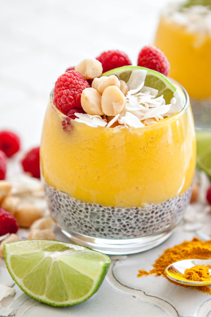coconut chia pudding parfait topped with tropical fruit puree