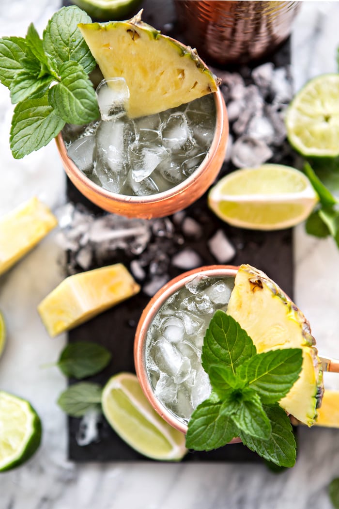 A classic Moscow Mule get a fruity twist with this recipe for Fresh Pineapple Mint Moscow Mules www.goodlifeeats.com @goodlifeeats