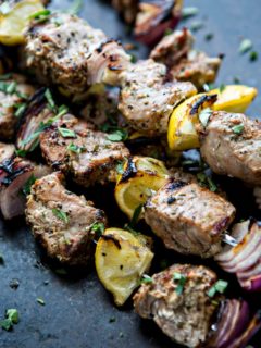 Fresh summer meals and outdoor entertaining are where it is at when it comes to this Greek Pork Kebab Platter with Greek Pico de Gallo. Juicy chunks of pork tenderloin are grilled with onion, lemon, and oregano and served platter style with Greek Pico de Gallo.