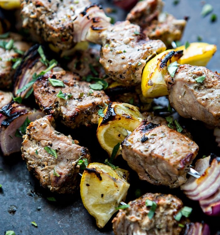 Fresh summer meals and outdoor entertaining are where it is at when it comes to this Greek Pork Kebab Platter with Greek Pico de Gallo. Juicy chunks of pork tenderloin are grilled with onion, lemon, and oregano and served platter style with Greek Pico de Gallo.