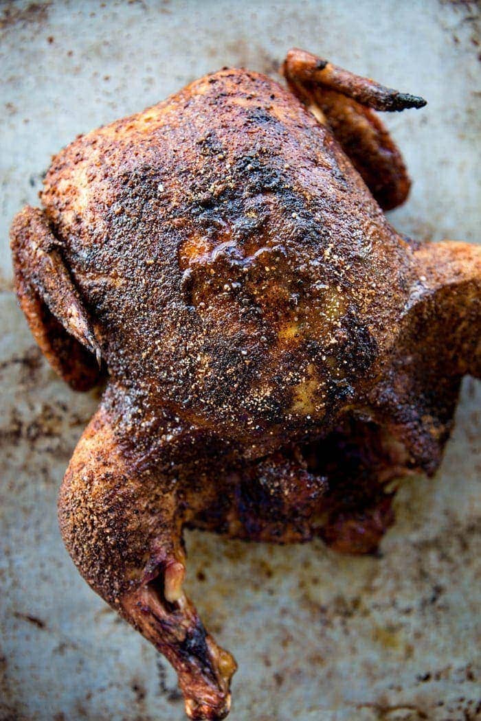 smoked whole chicken on baking sheet