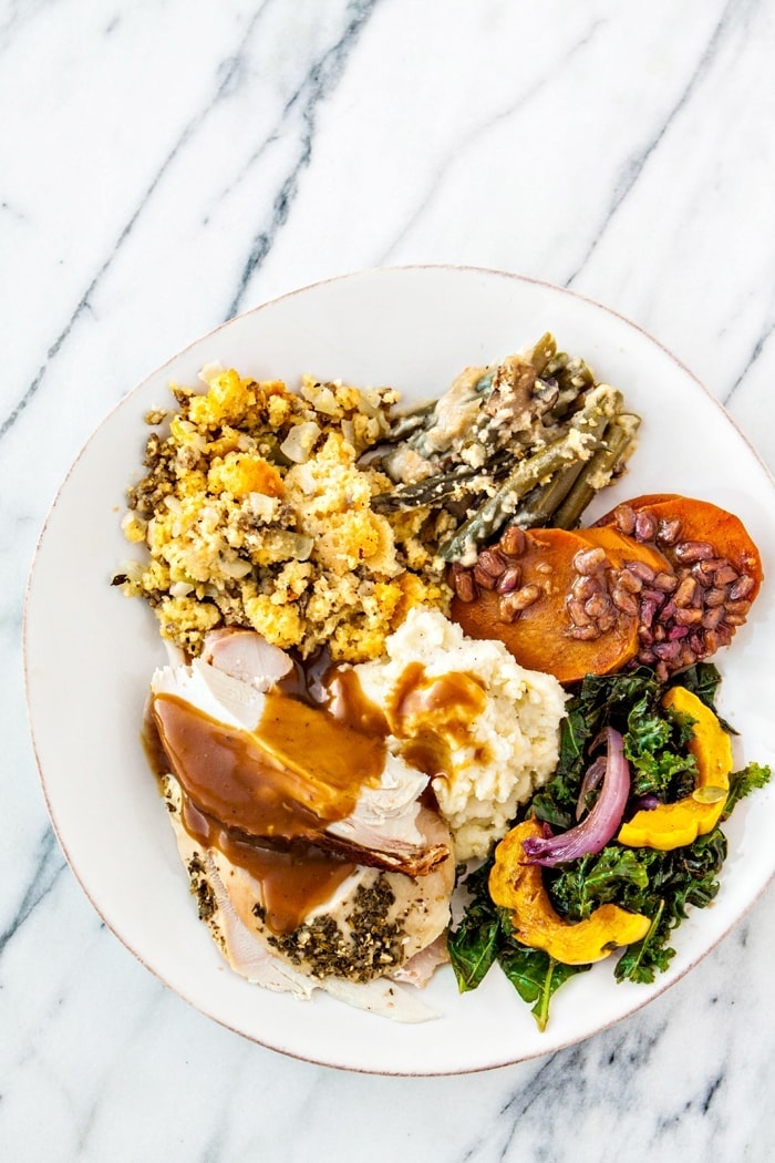 smoked turkey brine on juicy turkey with mashed potatoes, sweet potatoes, and more