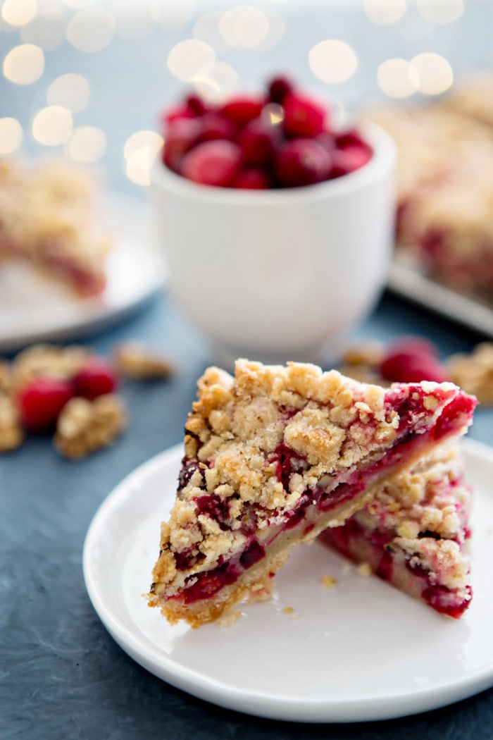 two cranberry bars on white plate