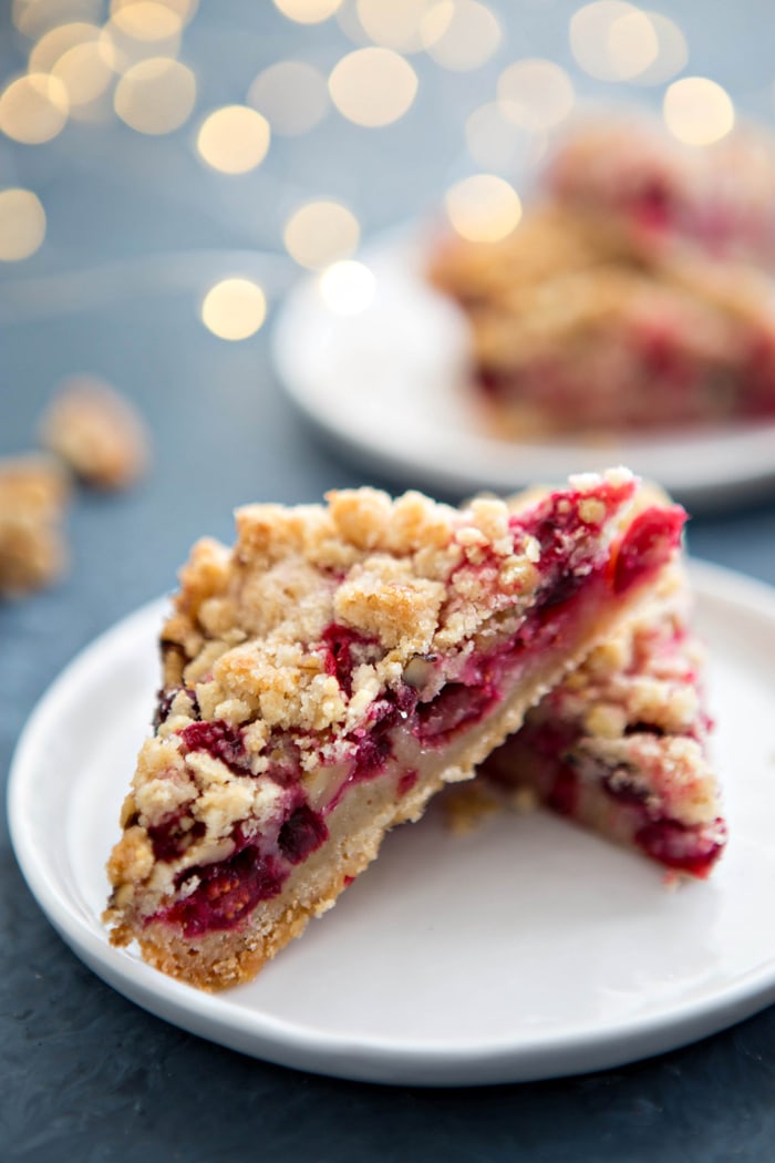two cranberry bars on white plate