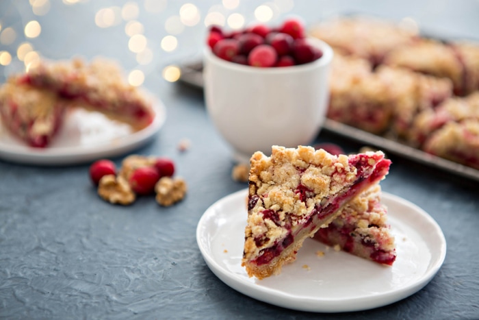 cranberry bars on white plates