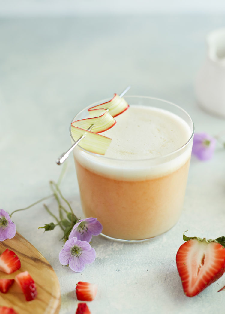 strawberry rhubarb whiskey sour in a glass