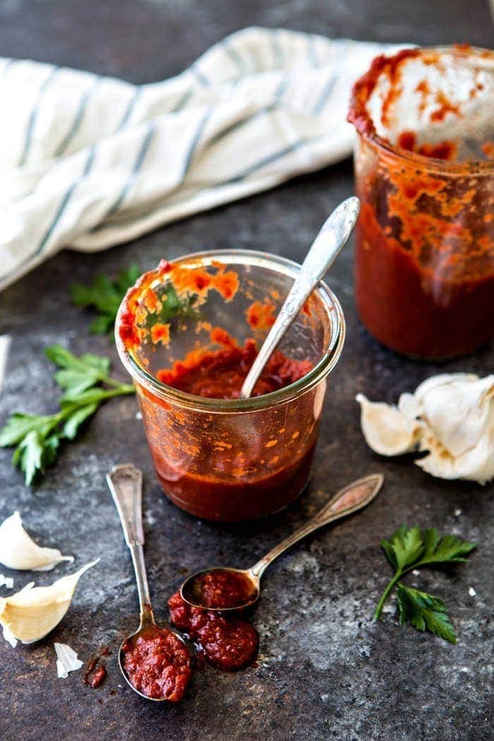 homemade marinara sauce in glass with three spoons