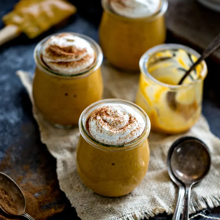photo of pumpkin pudding in jars with whipped cream