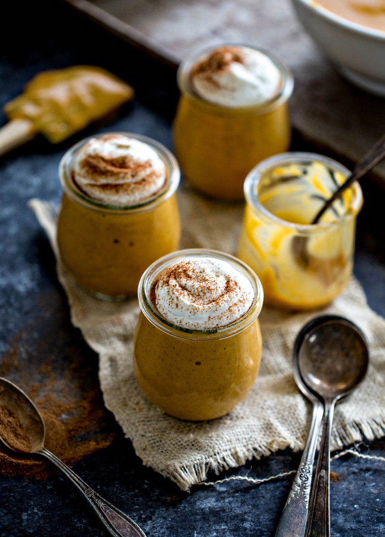 photo of pumpkin pudding in jars with whipped cream