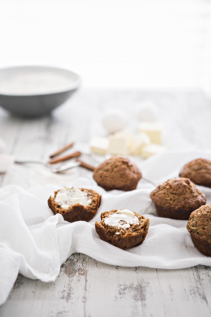 zucchini muffins on a white kitchen towel