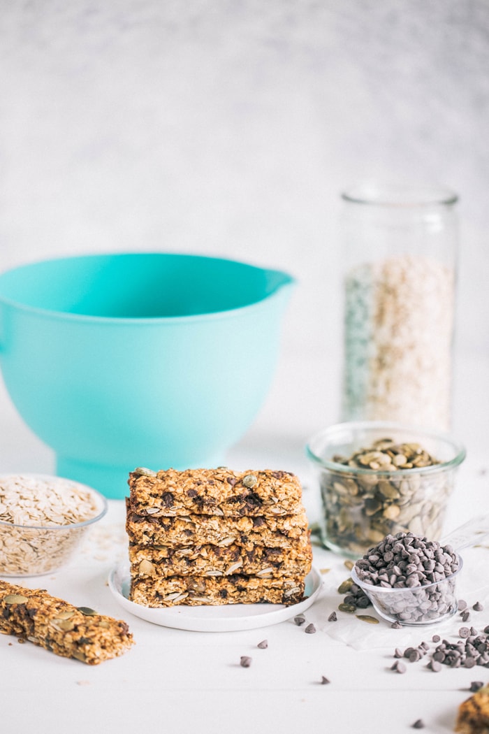 photo of a stack of pumpkin chocolate chip granola bars on a white plate