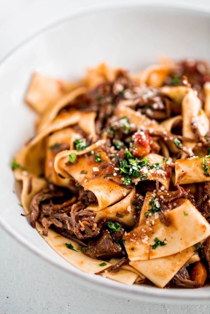 Chuck roast is cooked until tender with garlic, herbs, and plenty of tomatoes in this Instant Pot Italian Beef Ragu with Pappardelle for a delicious and hearty family pasta night recipe.
