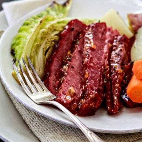 This Honey Marmalade Mustard Glazed Corned Beef is a fun take on the traditional St. Patrick's Day meal. Rather than stewing in the crock pot all day, the Corned Beef is braised with plenty of seasonings before broiling in the oven with a delicious Honey Marmalade Mustard Glaze.