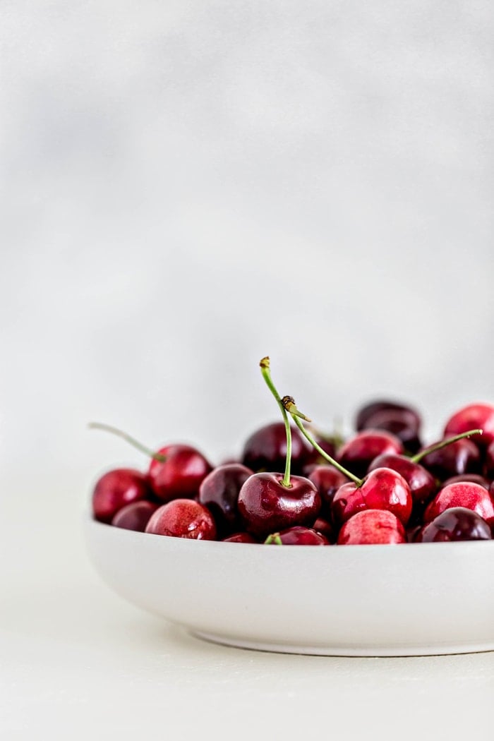 a bowl of fresh cherries to prepare for freezing