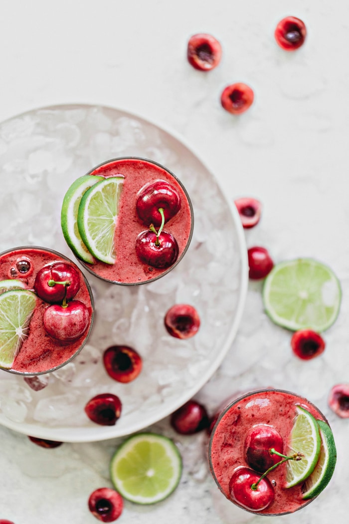 overhead images of cherry limeade slushes in a bowl with ice