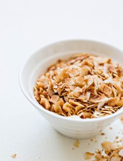 toasted coconut in a white bowl