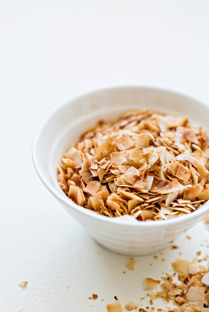 toasted coconut in a white bowl