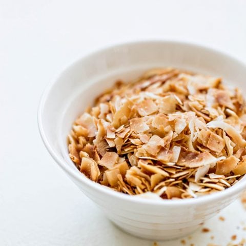 toasted coconut in a white bowl