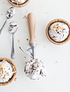 overhead shot of 3 wooden bowls of ice cream with 2 spoons