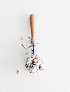 overhead shot of an ice cream scoop on white background