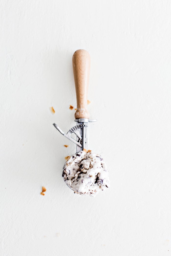 overhead shot of an ice cream scoop on white background