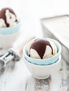 two bowls of vanilla ice cream with homemade magic shell chocolate topping