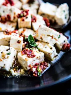 close up shot of feta with chopped sun dried tomatoes