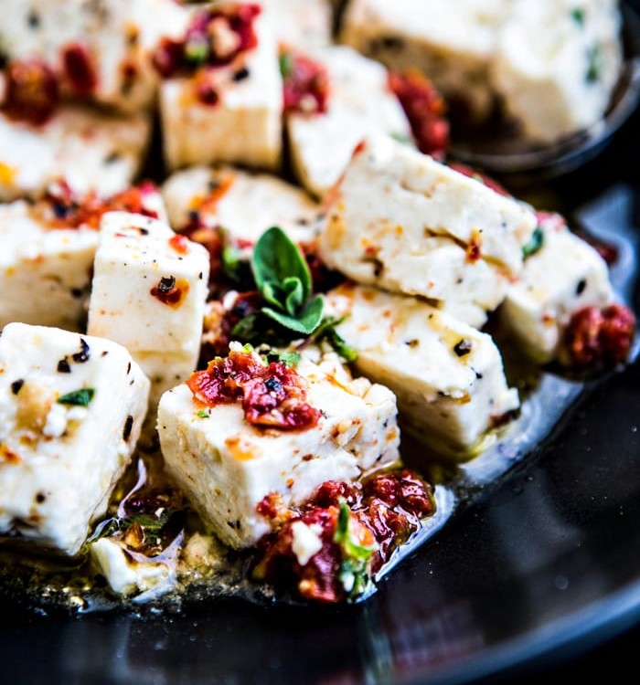 close up shot of feta with chopped sun dried tomatoes