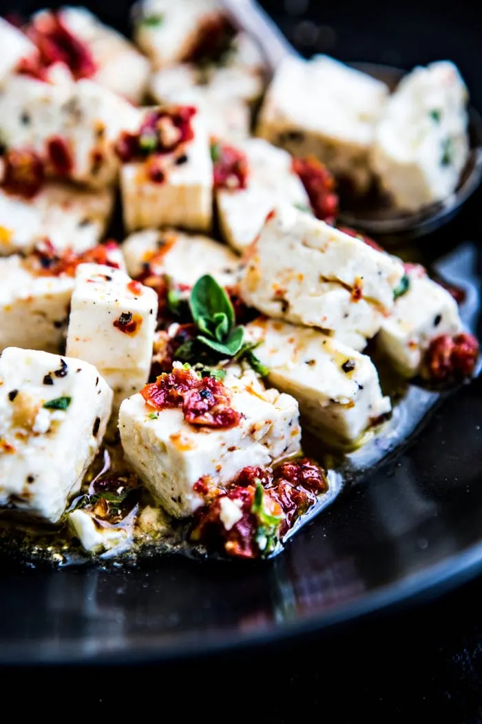 close up shot of feta with chopped sun dried tomatoes