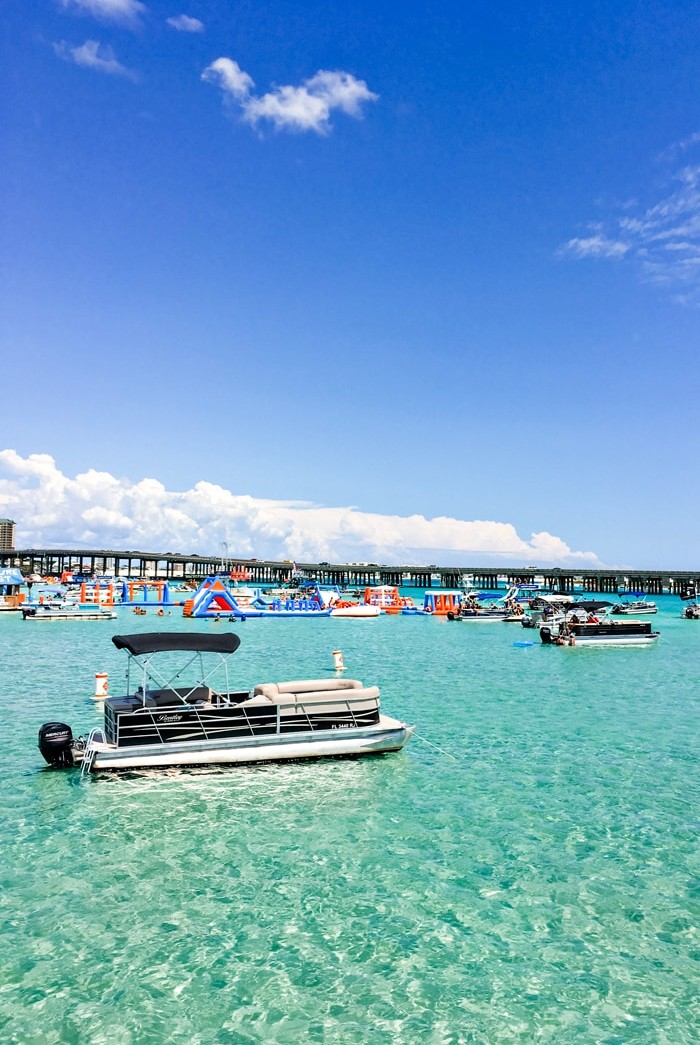 photo of bridge over the destin harbor with boats in crab island