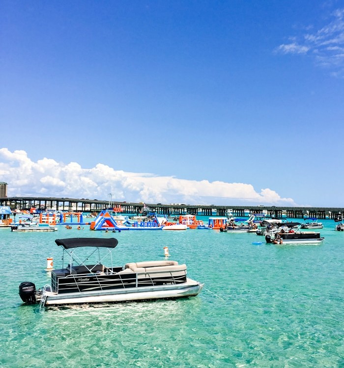 photo of bridge over the destin harbor with boats in crab island