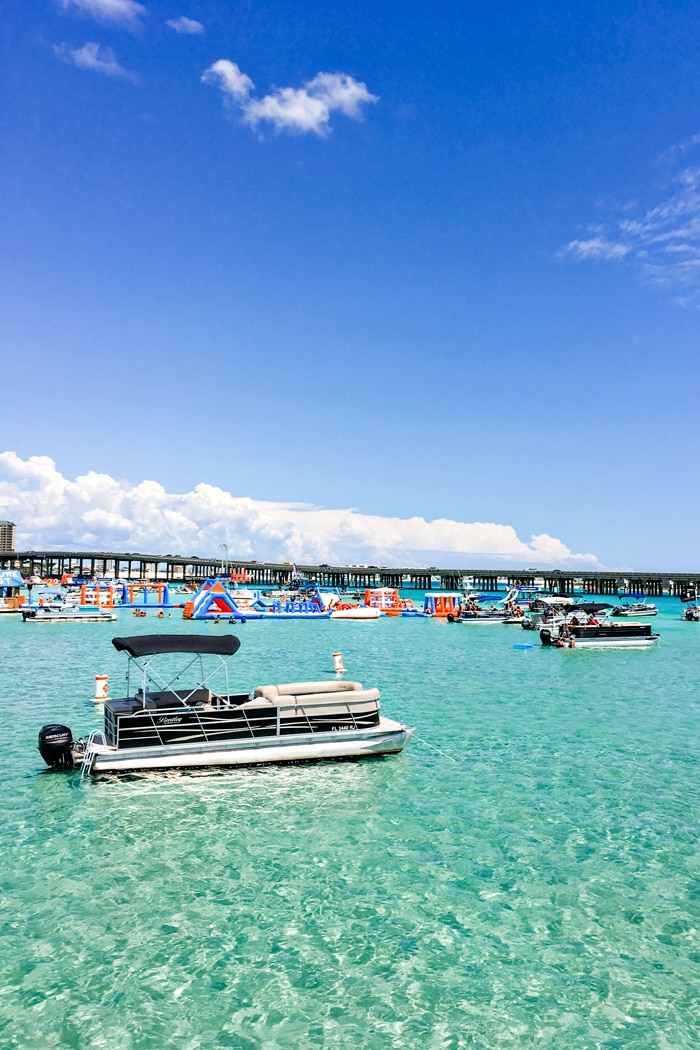 photo of boats at crab island, destin harbor crab island, and crab island inflatable park