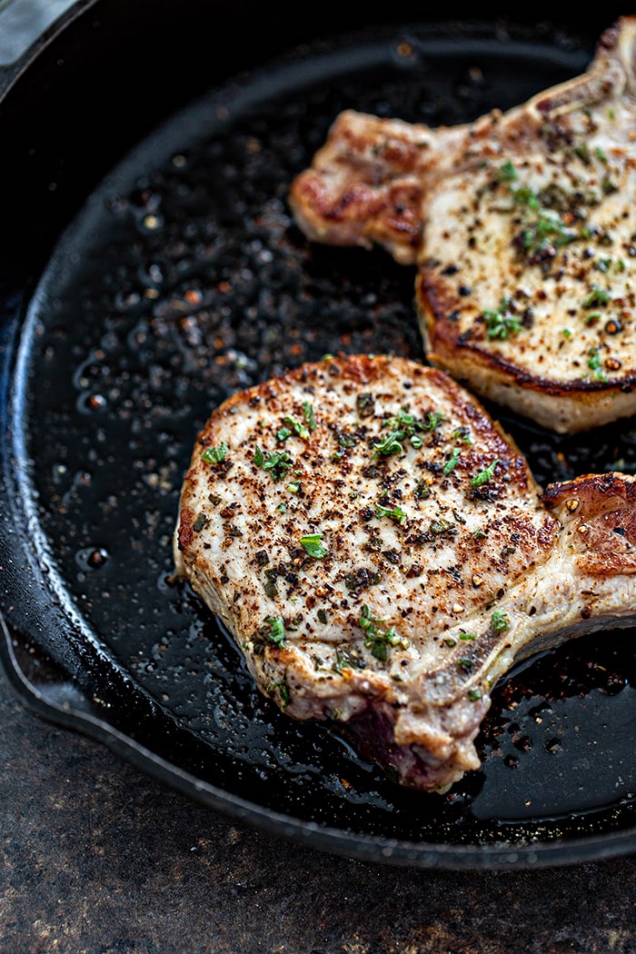 pork chops in a cast iron skillet