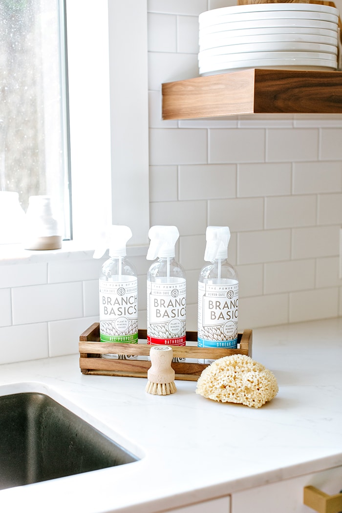 branch basics non toxic cleaners on a kitchen counter (includes a branch basics coupon code in the post)