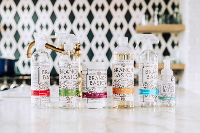photo of bottles of branch basics non toxic cleaners on a marble counter (includes a branch basics coupon code in the post)