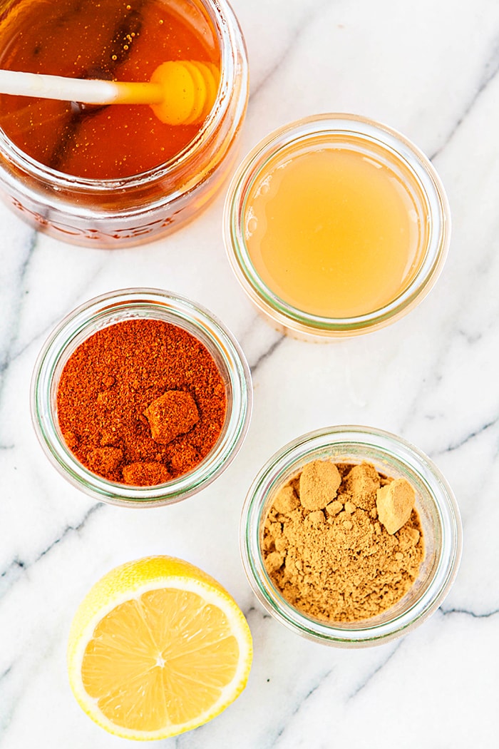 spices in jars on a white back ground