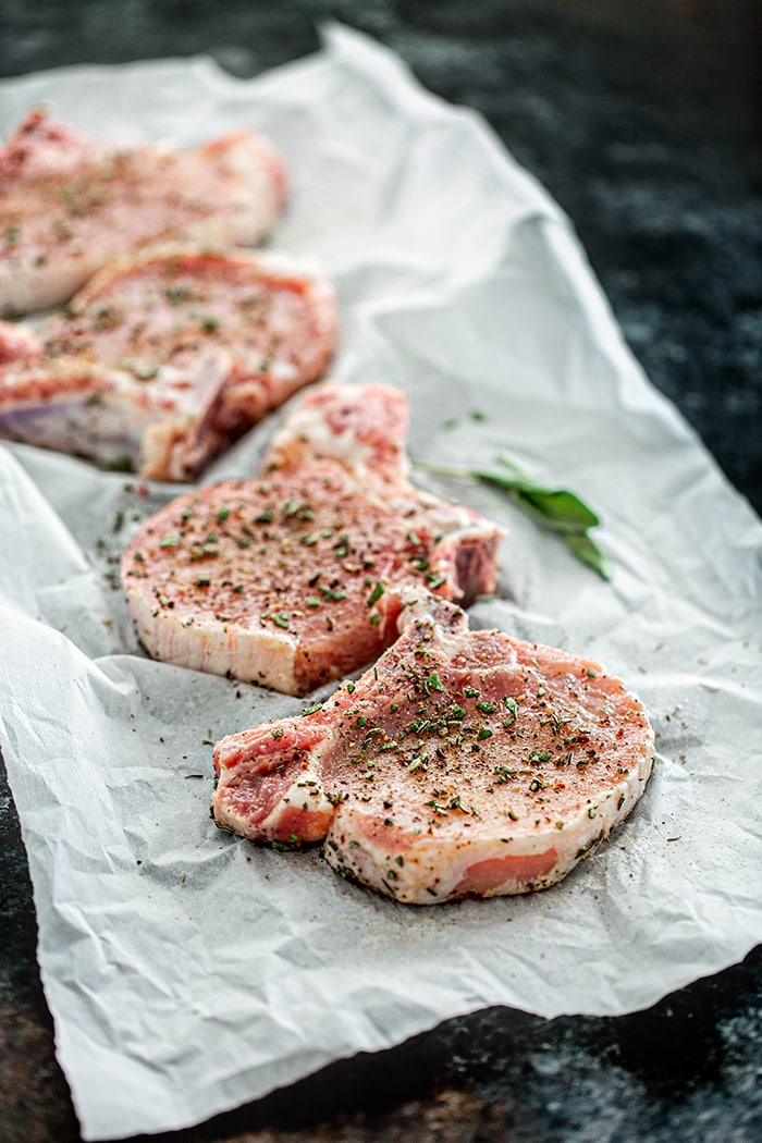 pork chops seasoned with sage, salt, pepper, and garlic
