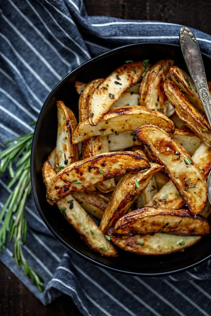 bowl with roasted potatoes and rosemary