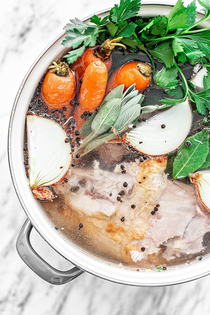 ingredients to make turkey stock cooking in pot