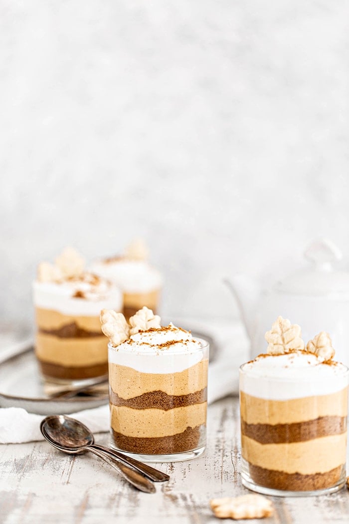 rustic wooden table set with four no bake pumpkin dessert
